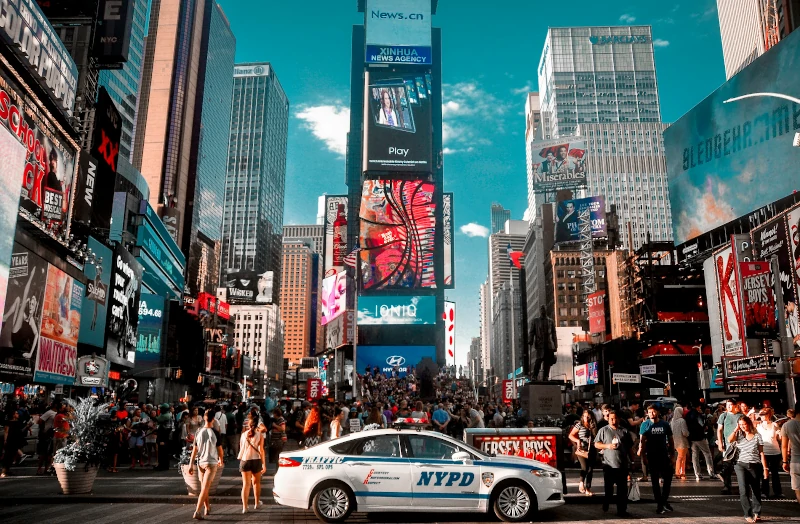 7th Avenue, Broadway, and Times Square bustling with people during the day