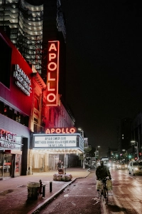 Nighttime photo of the Apollo Theater exterior near to Rockefeller Center