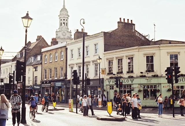 People walking along a quiet street in Greenwich, one of the best neighborhoods in London