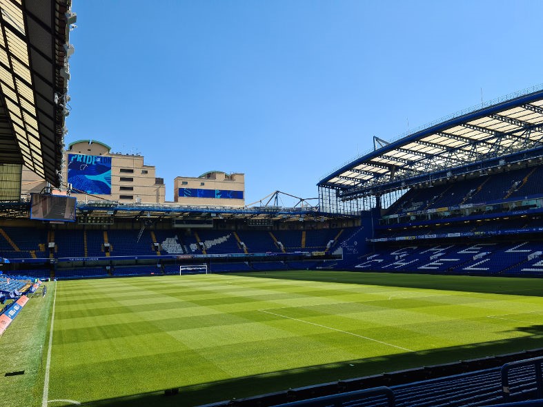 View of the interior of Stamford Bridge, one of the top football stadiums in London, showcasing its iconic pitch and stadium design.