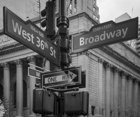 Black and white photo of a Broadway street sign