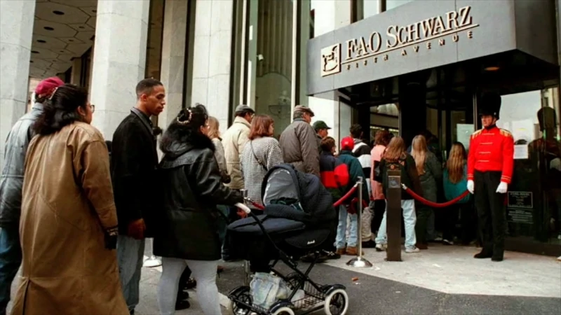 Customers entering the colorful FAO Schwarz toy store on 5th Avenue, New York