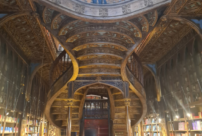 Lello Bookstore in Porto, Portugal, featuring its famous wooden staircase, a must-see for visitors exploring what to see in Porto.