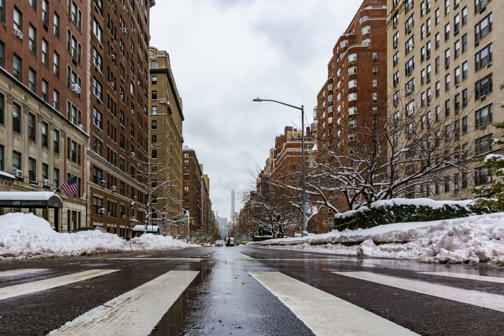 View of Park Avenue at East 90th Street, showcasing the tree-lined median and classic residential architecture of the Upper East Side.