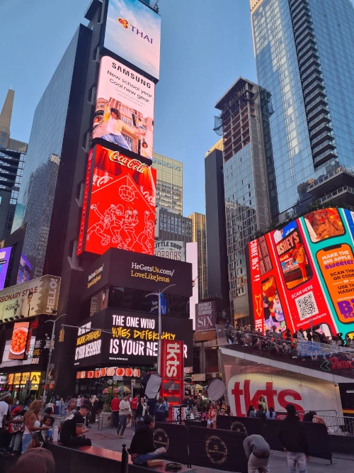 Illuminated view of Times Square at night